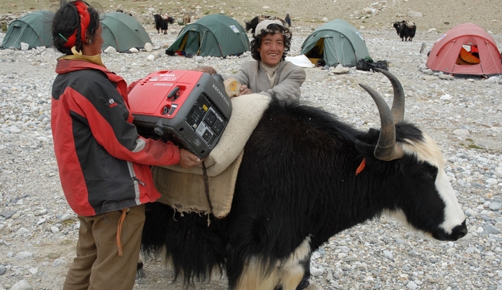 Honda generators being loaded onto a Yak