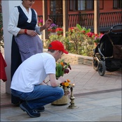 Dan lights a lamp at the arrival blessing