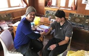 Eric takes blood from one of the research participants